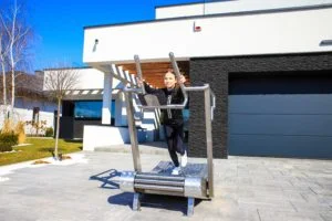 the girl walks on an outdoor treadmill 3rd image