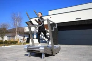Person performing sprint training on iGreenMill treadmill
